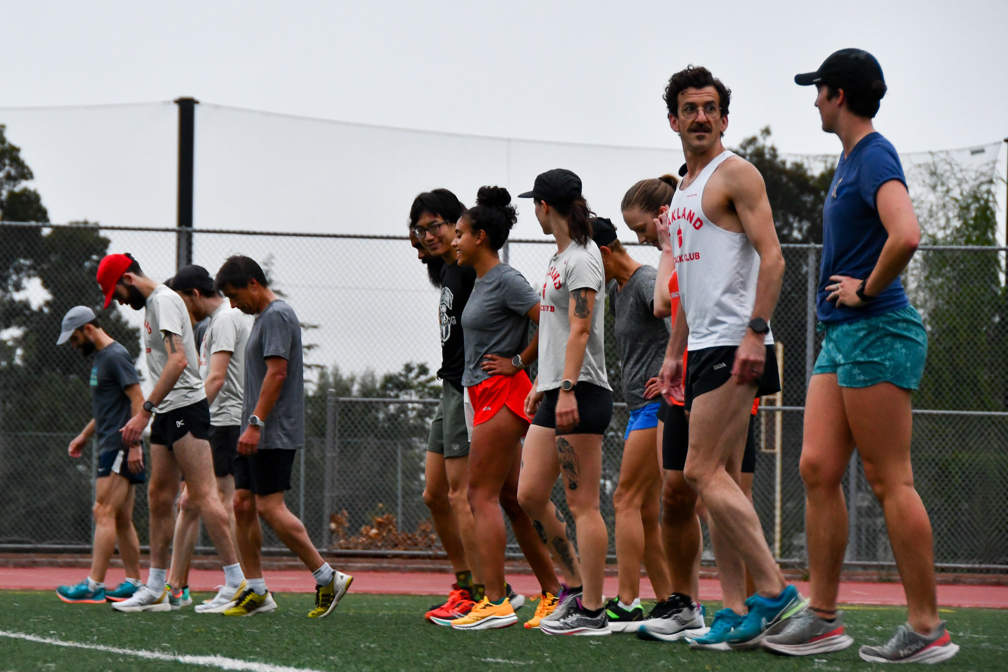 Oakland Track Club runners lined up at the track for a workout