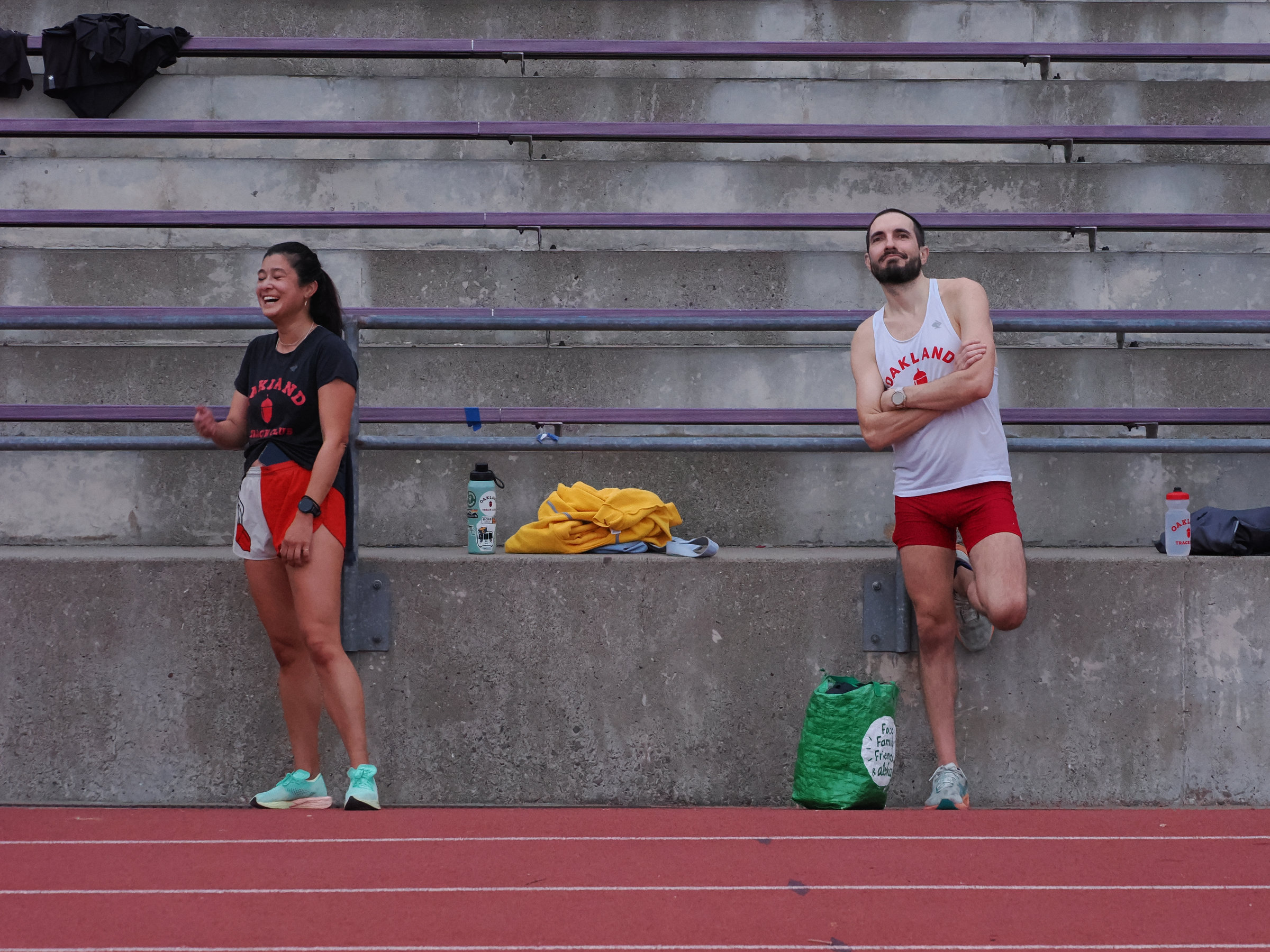 Two runners at a track