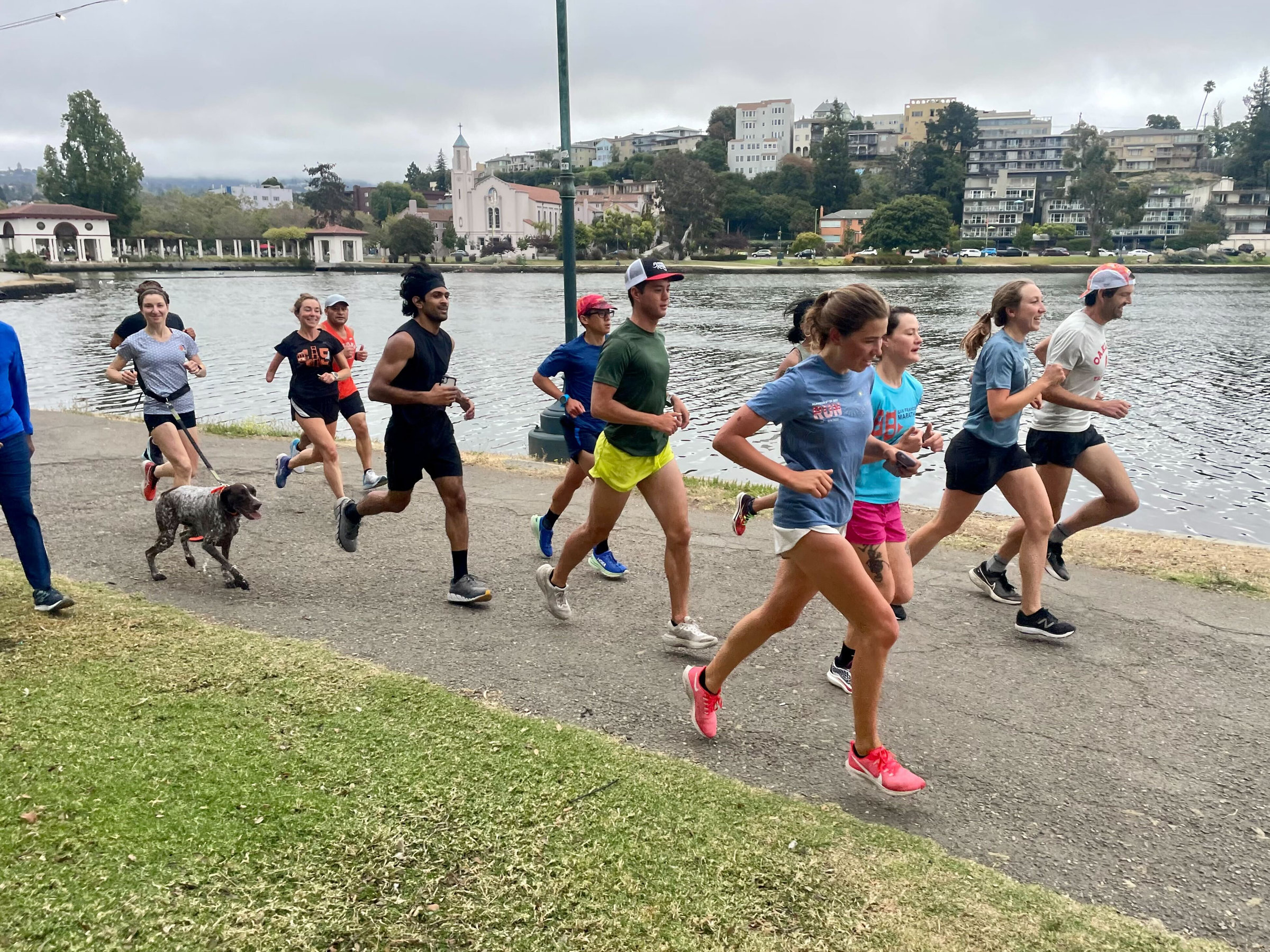Runners in front of a lake